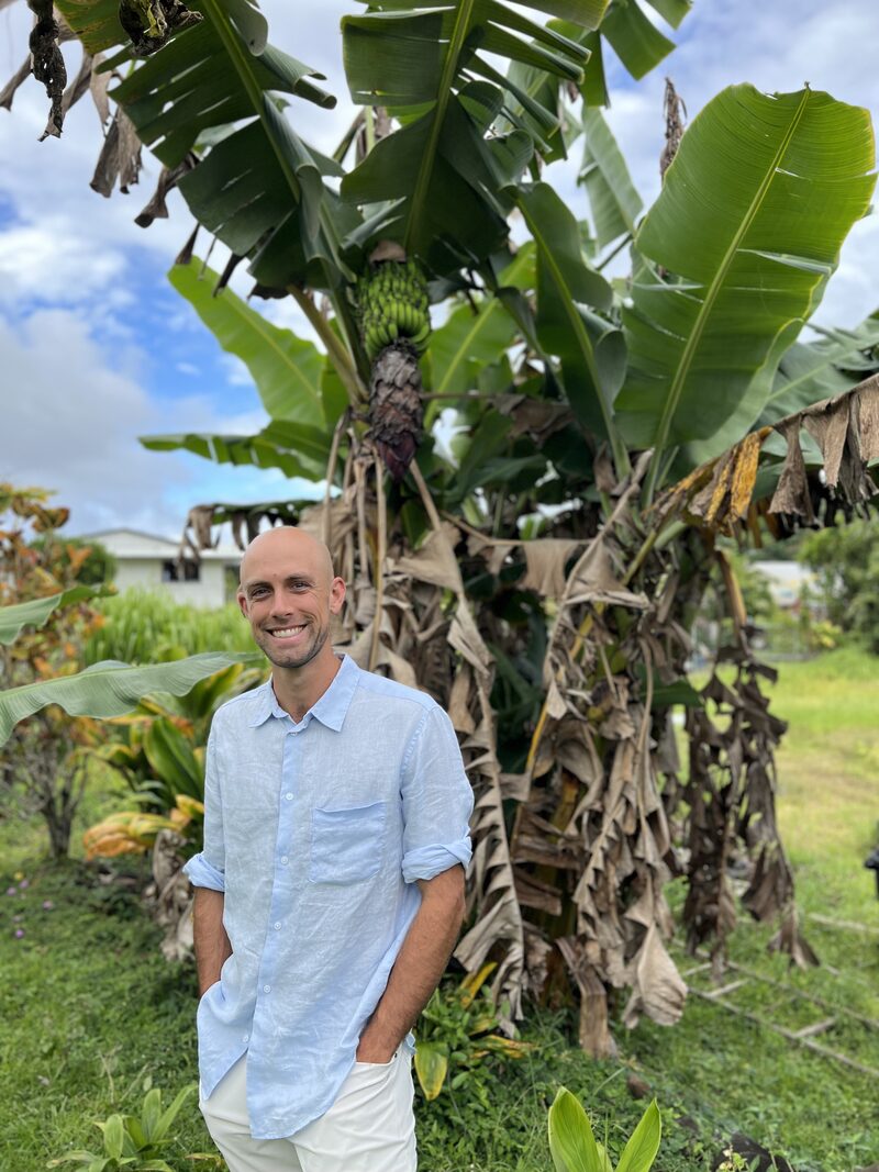 Erik DeGunther among banana plants
